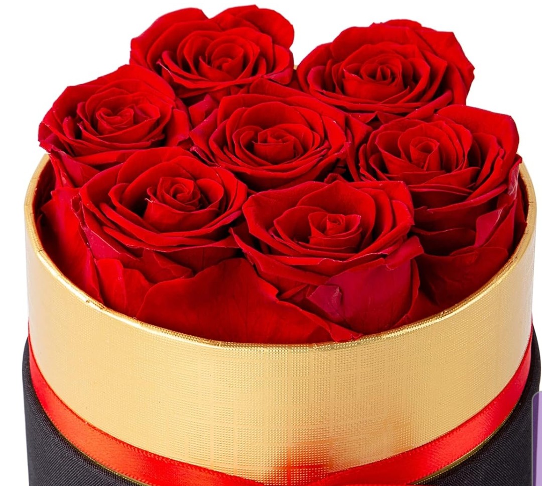 Red preserved flowers 7 roses in a gift black box.